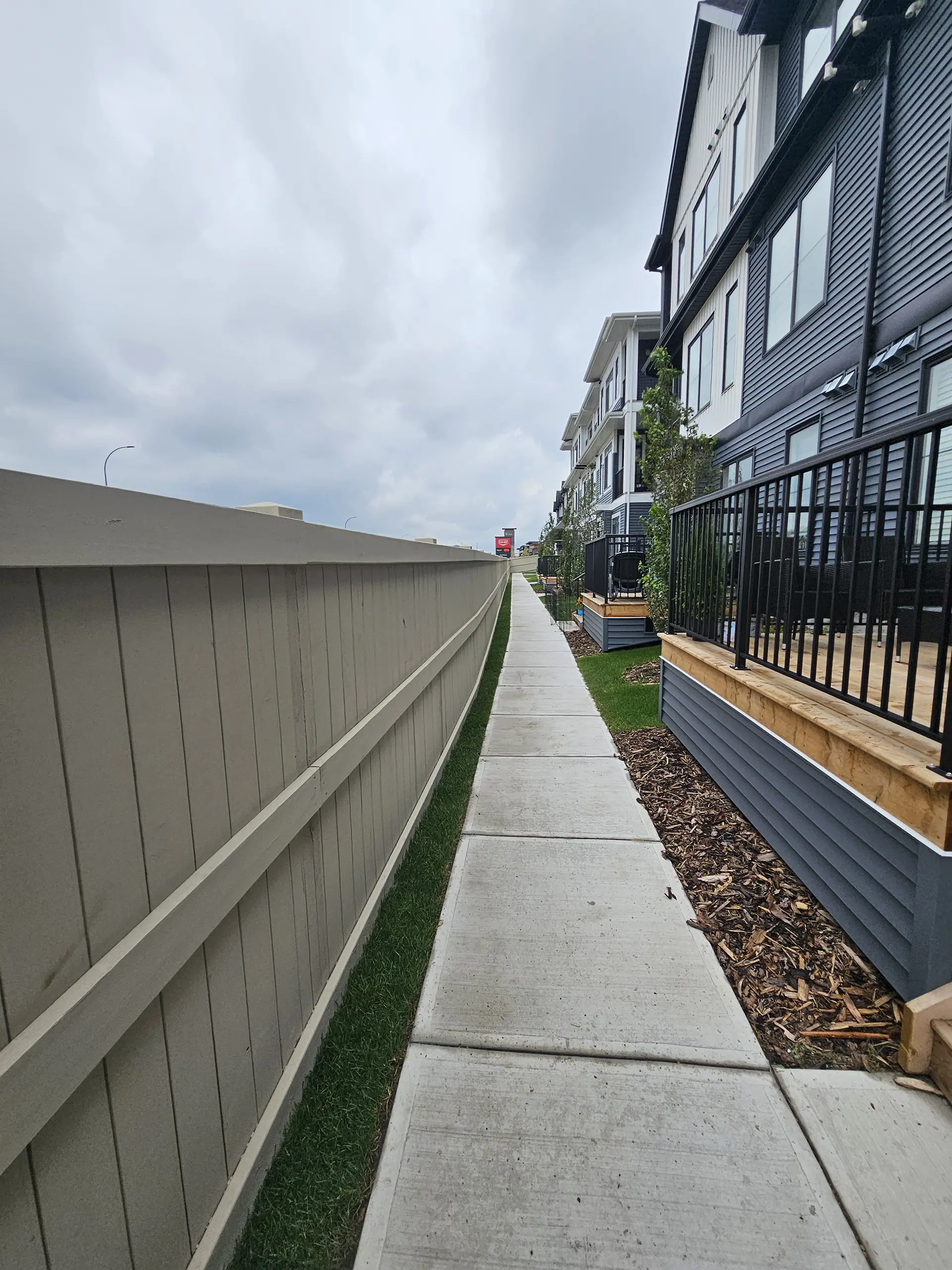 Stained single picket fence in Edmonton community